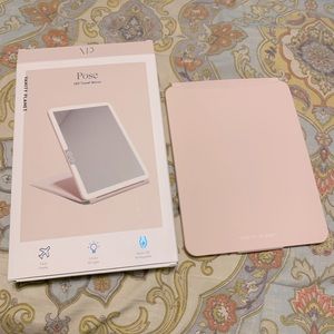 Folding lighted makeup mirror by Vanity Planet